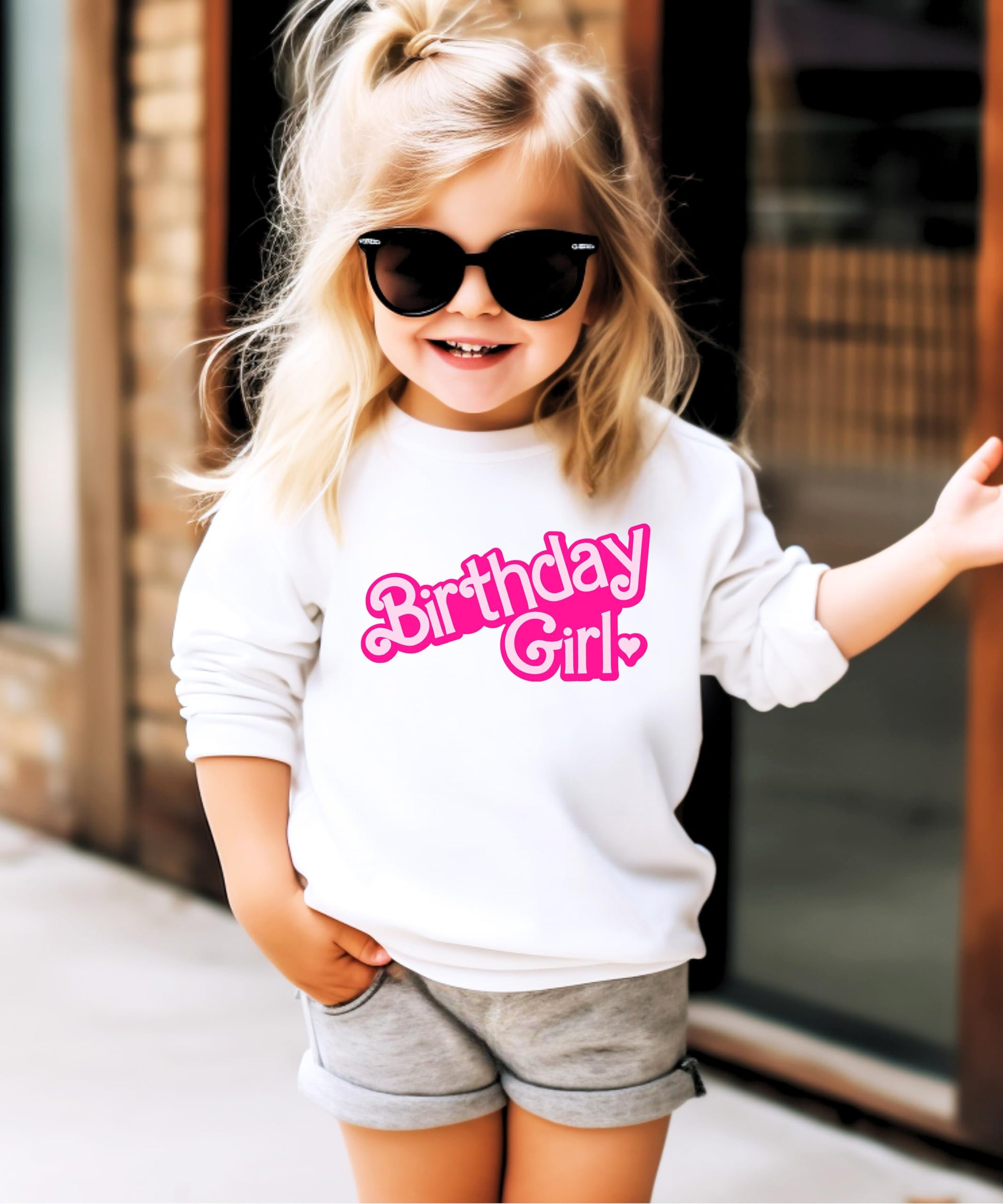 Side or detail view of pink Birthday Girl sweatshirt for toddler and youth sizes