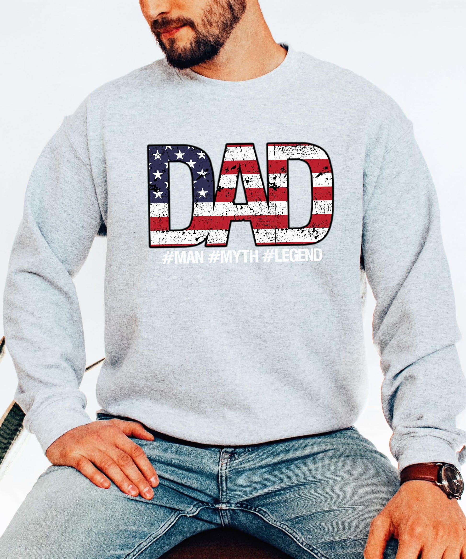 Close-up of Dad Man Myth Legend sweatshirt print showing weathered American flag letter detail