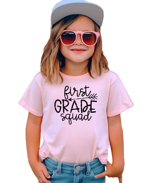 Front view of 1st Grade Squad boho shirt for toddler girls with colorful graphic print