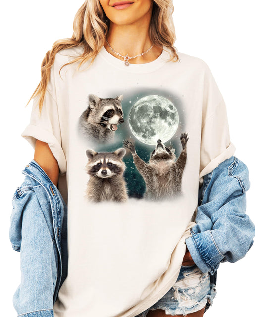 Close-up of raccoon howling at moon graphic print on ivory women's t-shirt, vintage distressed style