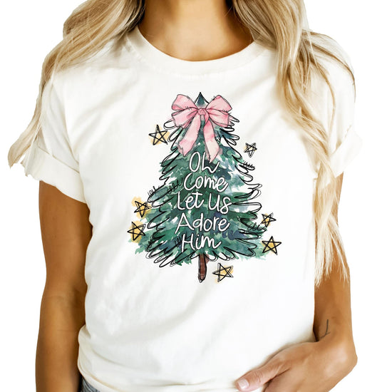 Detailed graphic of illustrated Christmas tree with pink bow on girls holiday tee