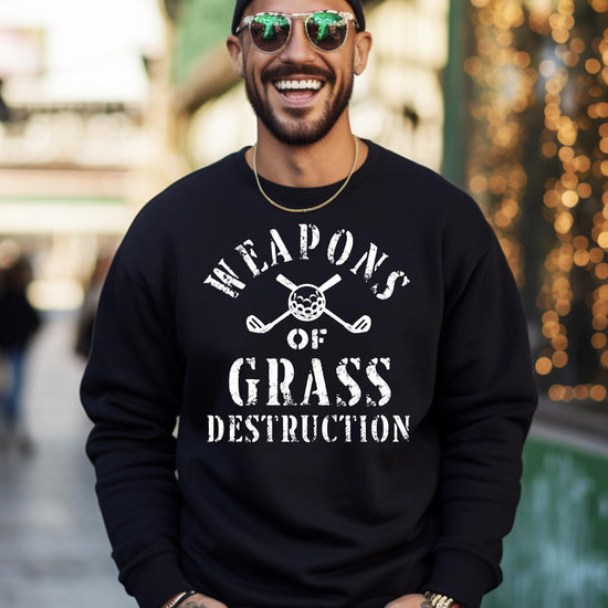 Male model wearing black Weapons of Grass Destruction golf pullover sweatshirt