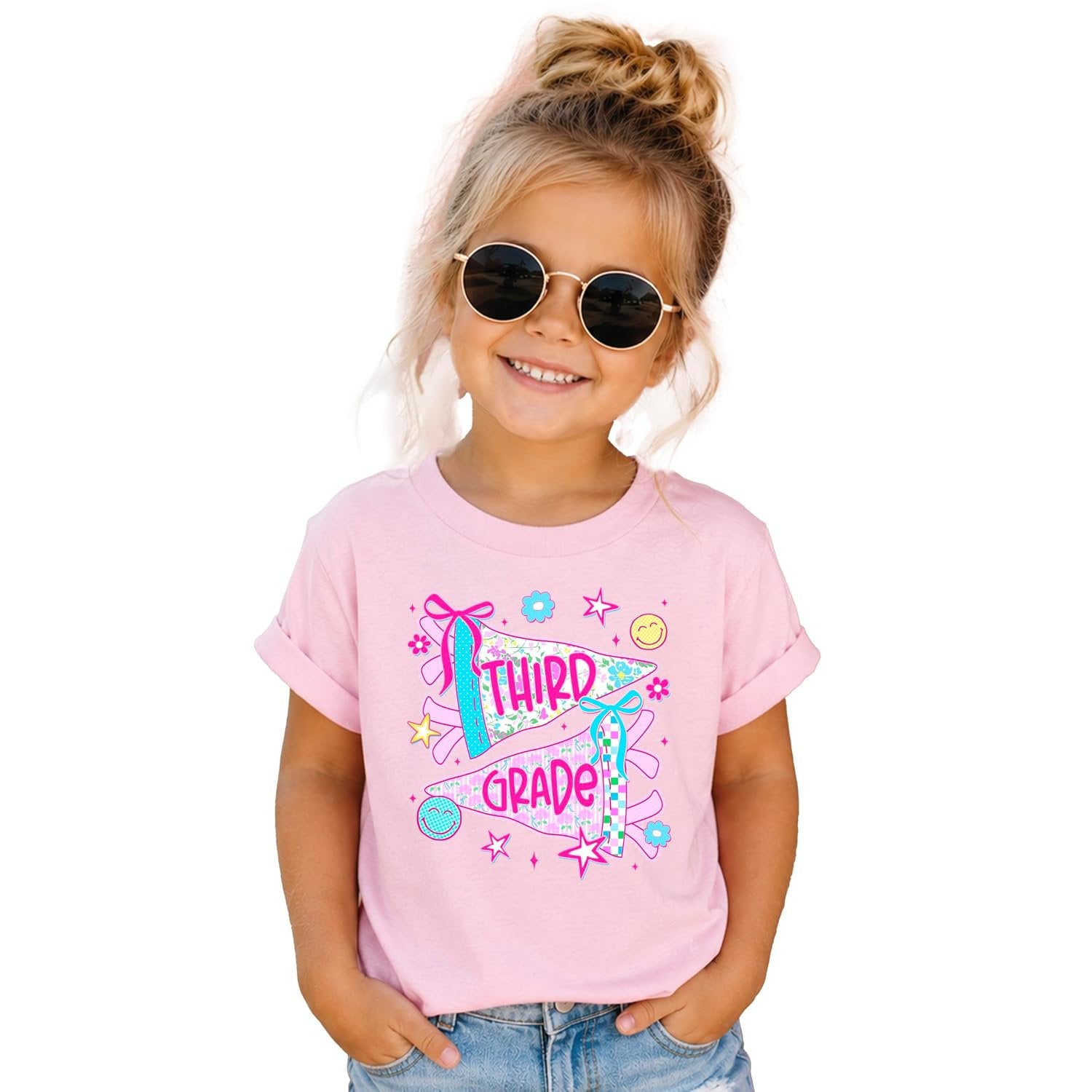 Close-up of third grade graphic tee showing coquette bows, ditsy florals, and bright pink pennant flags