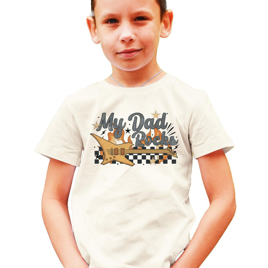 Front view of peach My Dad Rocks rocker graphic tee for toddlers and kids