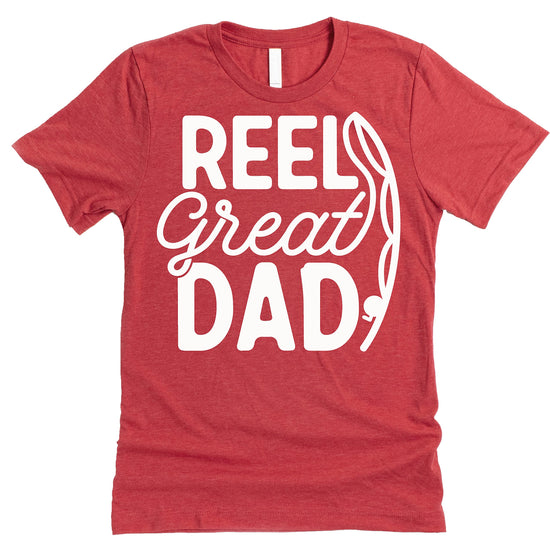 Close-up of Reel Great Dad fishing graphic print on red t-shirt