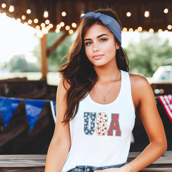 Model wearing USA floral tank top, casual summer patriotic outfit