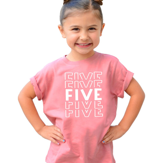 Girl wearing bold fifth birthday graphic tee in military green and white