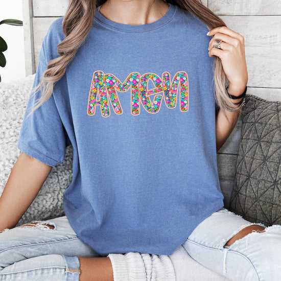 Women's Christian Amen graphic tee styled casually, colorful floral design perfect for church or everyday wear