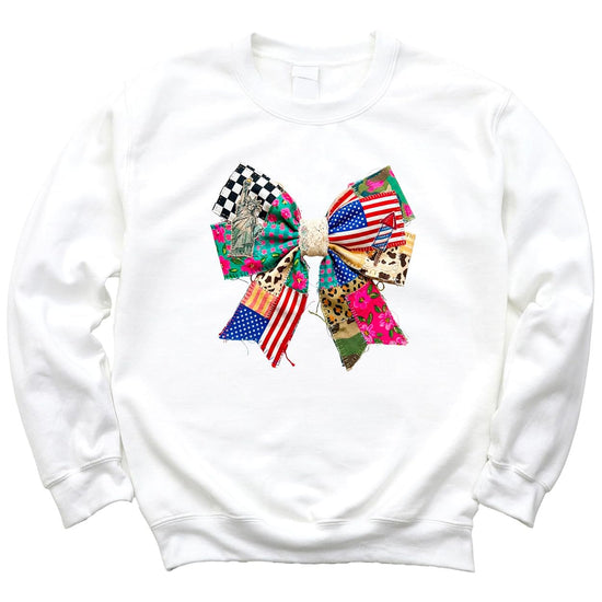 Flat lay of white coquette sweatshirt with Americana bow graphic on neutral background showing full design