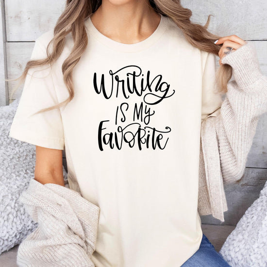 Woman modeling natural colored Writing is My Favorite script t-shirt