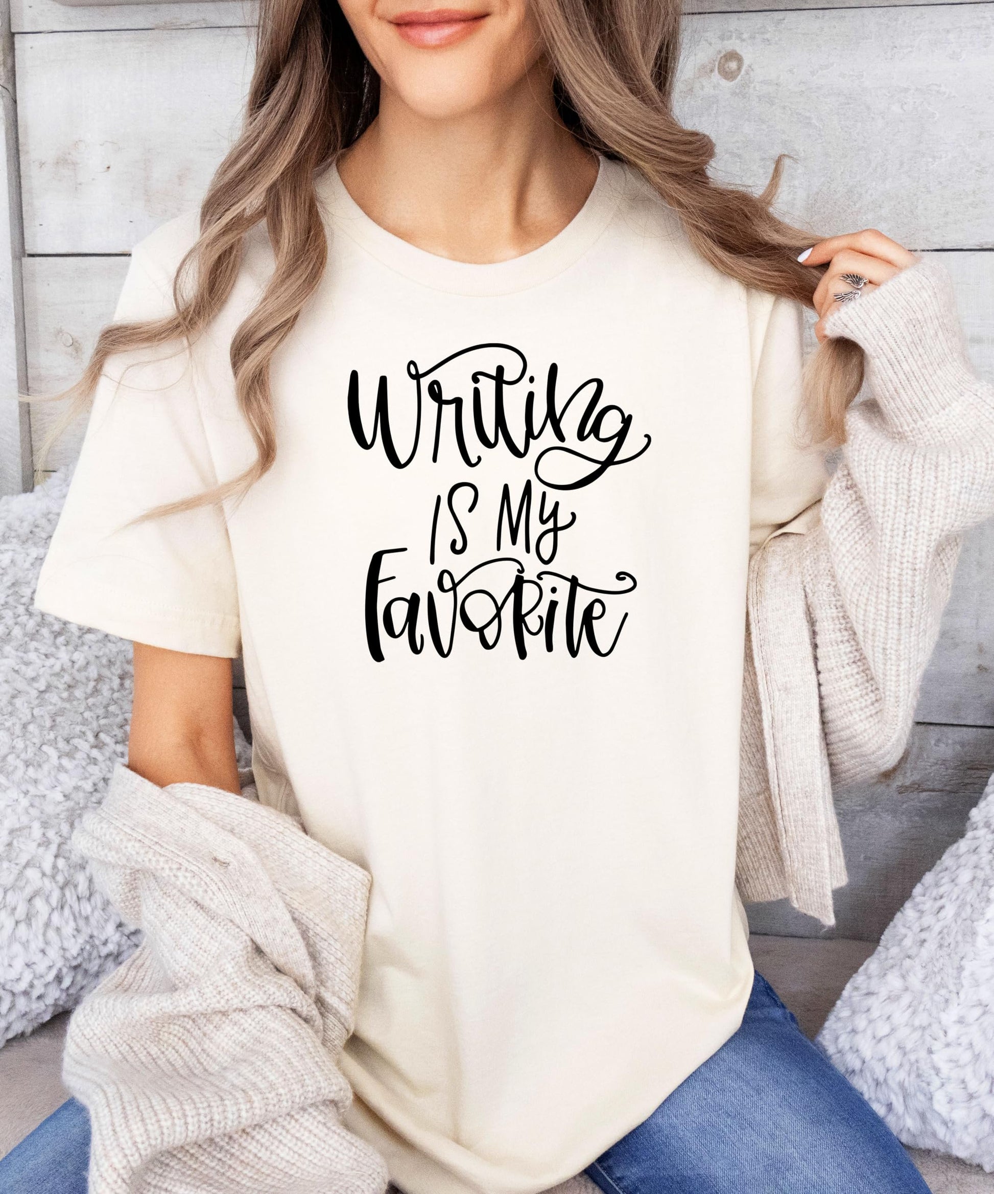 Woman modeling natural colored Writing is My Favorite script t-shirt