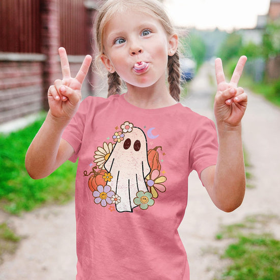 Purple Halloween shirt for toddler girls with groovy ghost design, laid flat