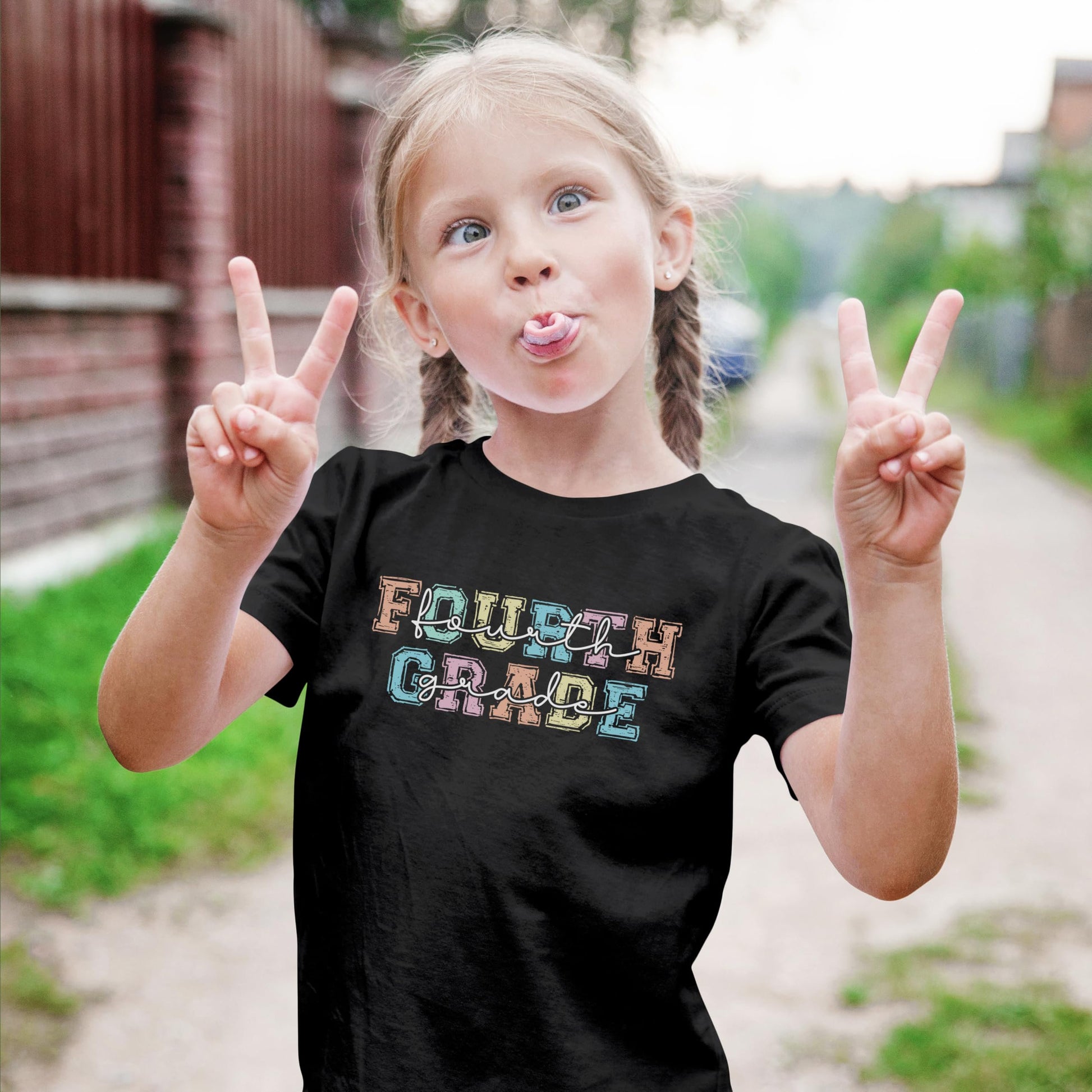 Kids fourth grade shirt with colorful pastel typography design, shown as a back to school outfit idea for girls