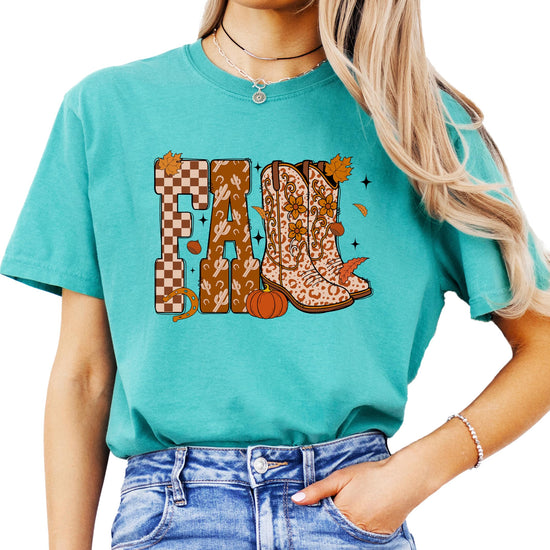 Close-up of fall cowboy boots graphic on seafoam women's tee showing pumpkins and leaf details