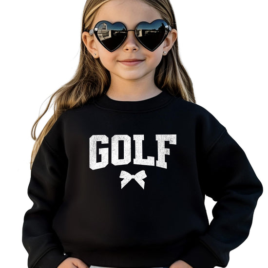Close-up of GOLF collegiate lettering and sweet bow graphic on red crewneck sweatshirt
