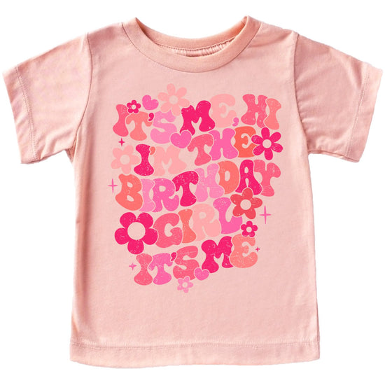 Close-up of groovy floral birthday girl graphic print on peach youth tee