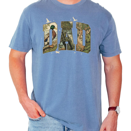 Close-up of retro camo DAD hunting tee print showing duck and deer hunting scene