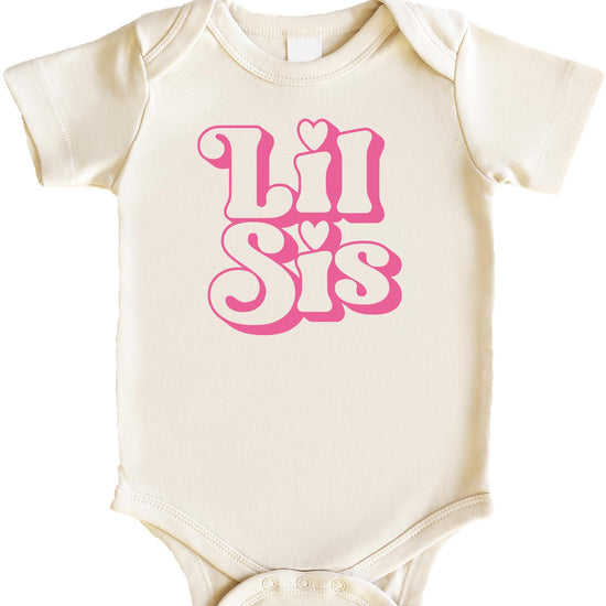 Close-up of retro pink Little Sister graphic print on natural baby girl one-piece bodysuit