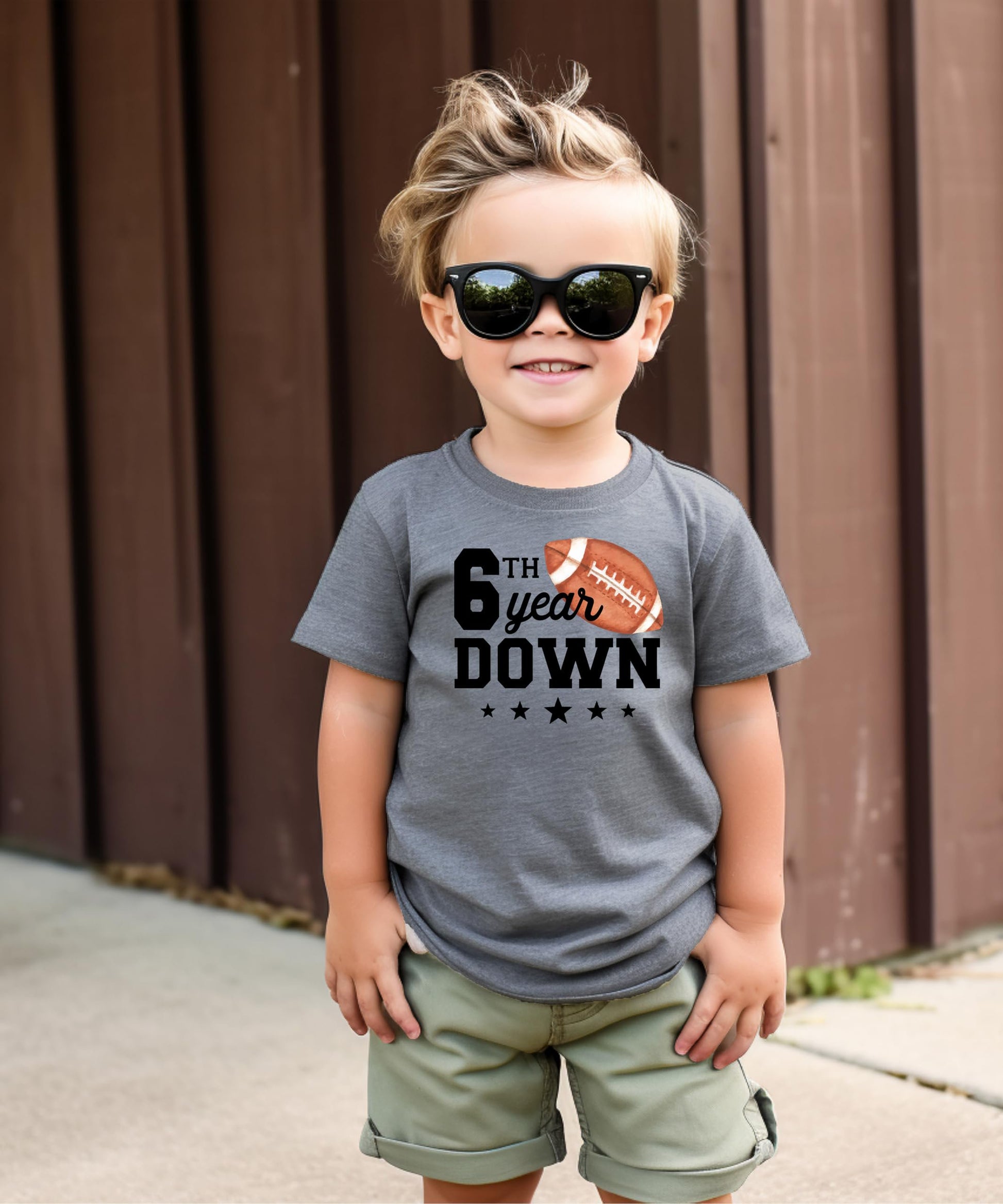 6 year old birthday football tee laid flat showing full graphic print detail