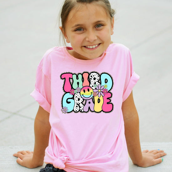 Youth girl wearing retro Third Grade natural tee, perfect first day of school outfit
