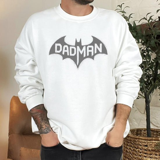 Man wearing DadMan Hero funny dad sweatshirt with superhero bat graphic