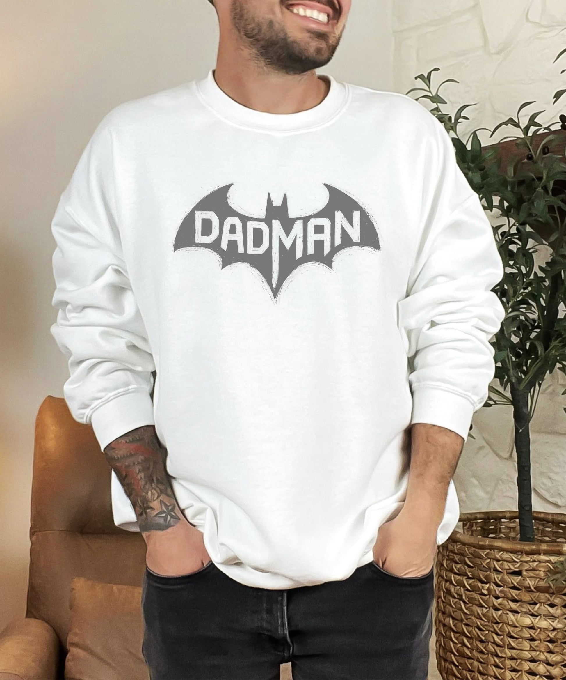 Man wearing DadMan Hero funny dad sweatshirt with superhero bat graphic