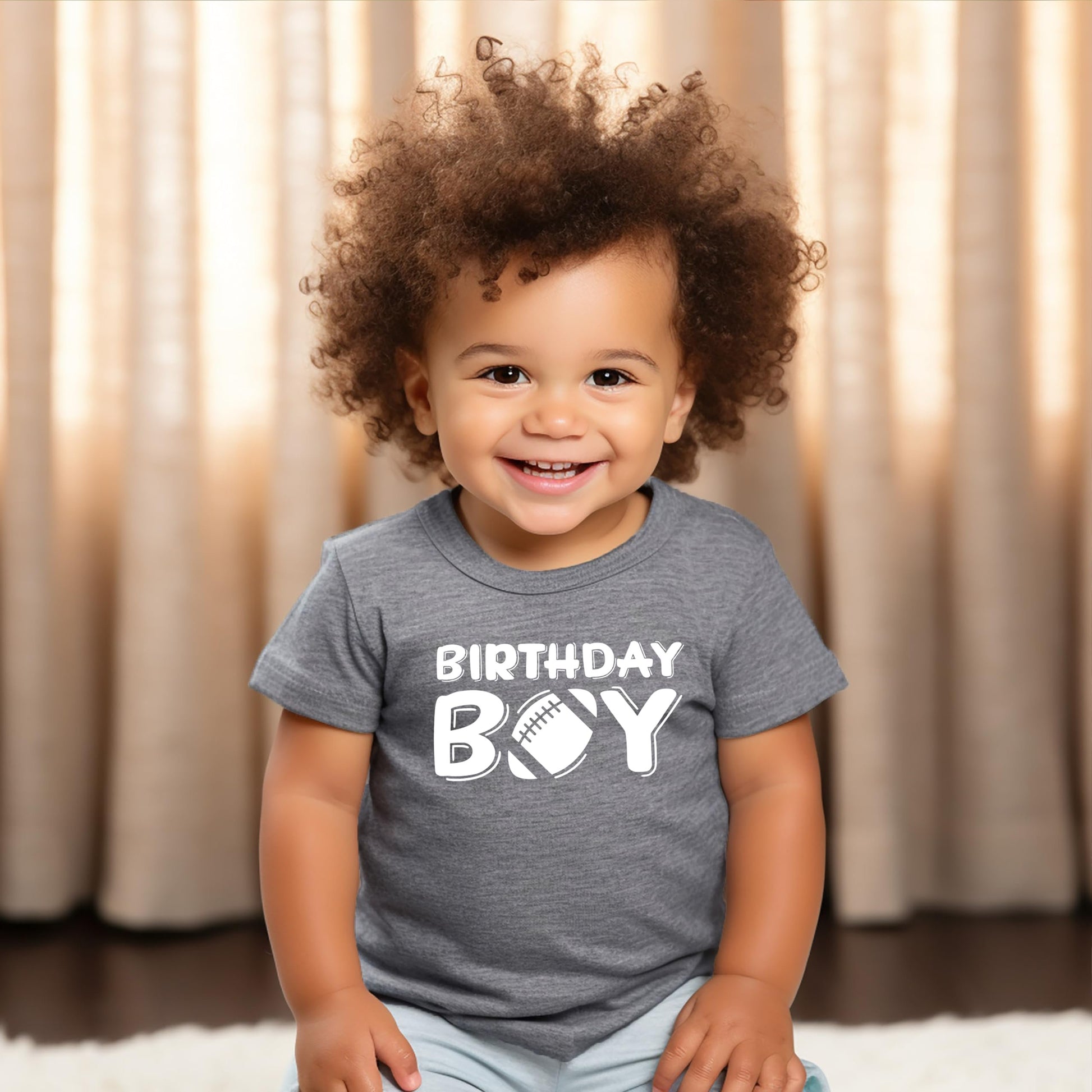Football birthday shirt for boys laid flat showing full graphic design in granite heather