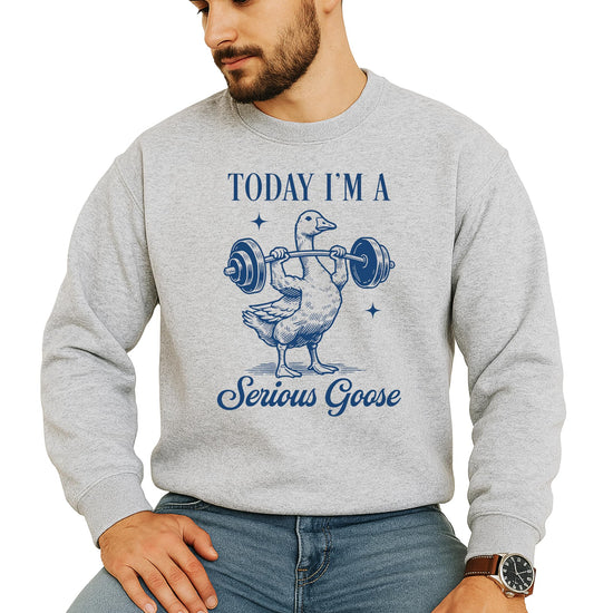 Close-up of funny muscular goose lifting weights print on black pullover sweatshirt
