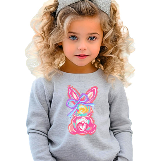 Side or styled view of Olive Loves Apple girls Easter bunny sweatshirt for spring and Easter celebrations