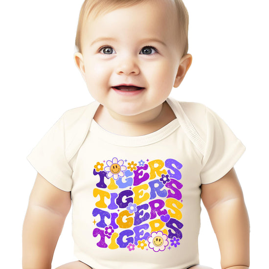 Model wearing Purple Tigers team spirit t-shirt styled casually