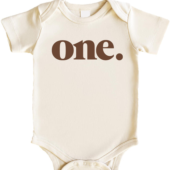 Flat lay of mauve Bold One birthday bodysuit showing full graphic design for baby's first birthday