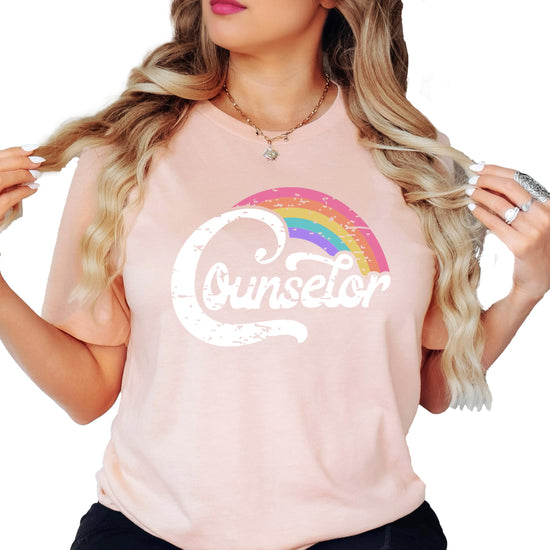 Lifestyle or styled shot of black women's rainbow counselor shirt for back to school