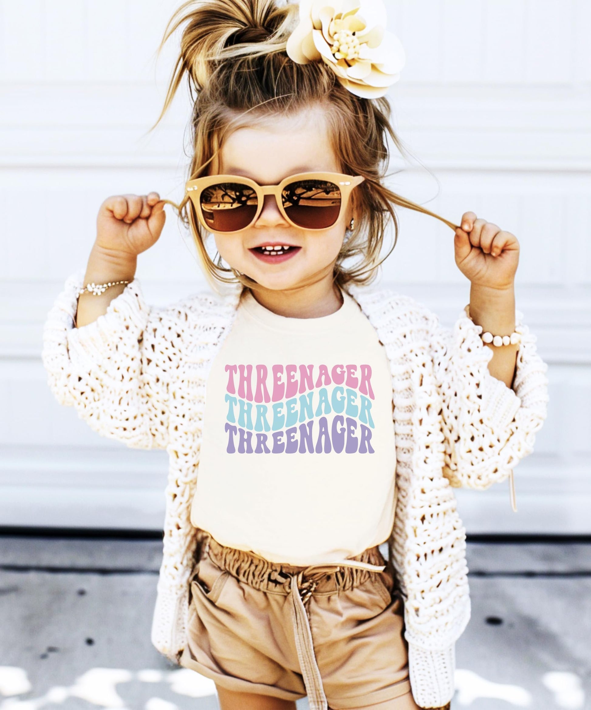 Close-up of Threenager groovy third birthday graphic tee print for toddler girls