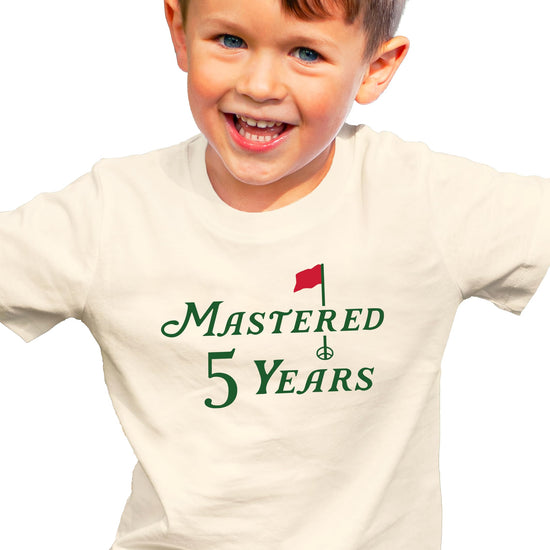 Kids golf themed 5th birthday shirt laid flat showing full design detail