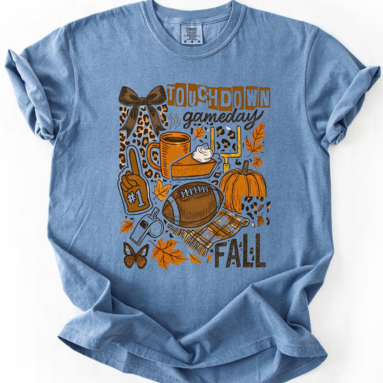 Fall football graphic tee styled on model showing relaxed fit and autumn-themed design