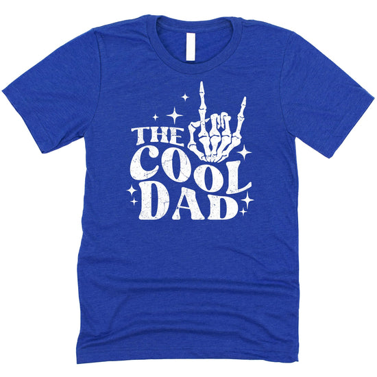 Lifestyle shot of men's cool dad rock skeleton hand graphic tee in black