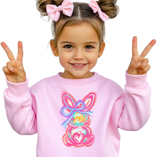 Flat lay of white kids sweatshirt featuring whimsical painted Easter bunny coquette graphic