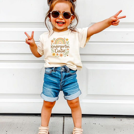 Back-to-school styling of Kindergarten Cutie boho shirt paired with jeans and backpack