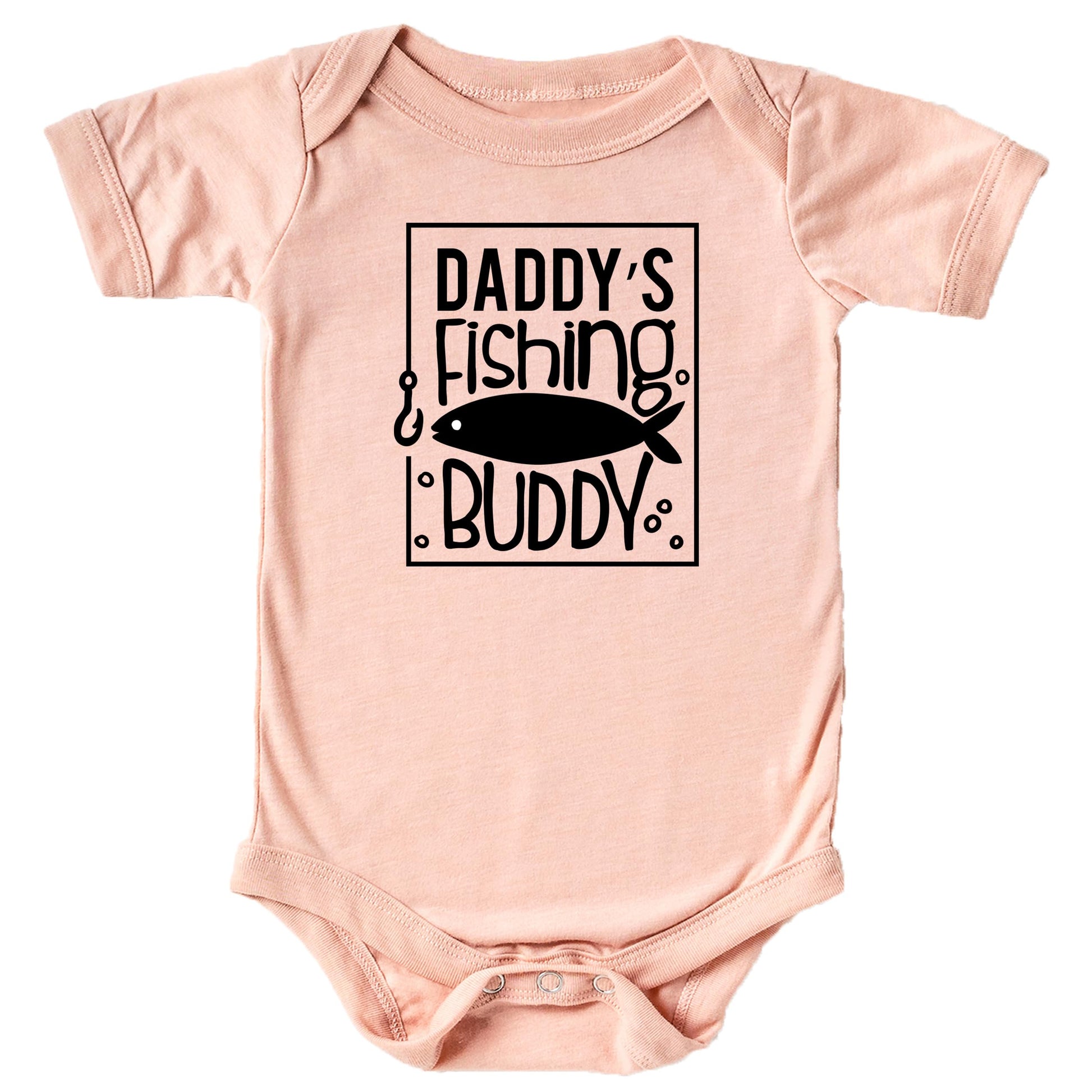 Close-up of Daddy's Fishing Buddy print on peach baby bodysuit showing bold graphic detail