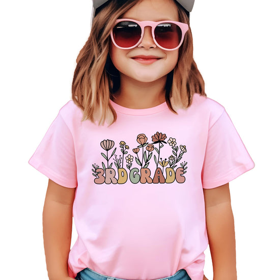 Close-up of 3rd grade flower graphic print on military green girls youth tee