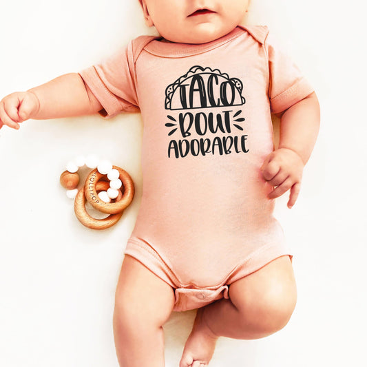 Side view of baby bodysuit showing sleeve and neckline construction