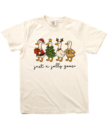 Close-up of Just a Jolly Goose holiday graphic tee print showing four festive cartoon geese in Christmas costumes