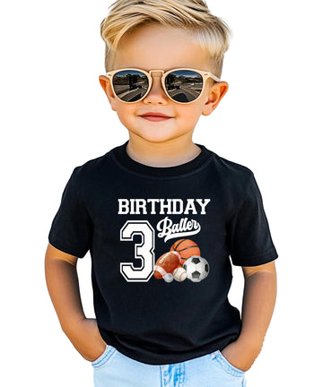Boys wearing Birthday Baller sports graphic tee for third birthday party