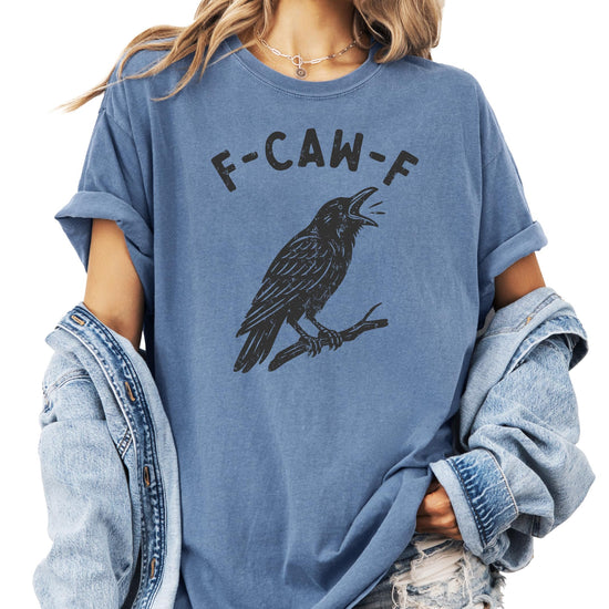 Seafoam green adult graphic tee featuring a bold black crow and the funny phrase F-Caw-F for Halloween