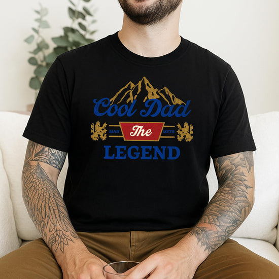 Flat lay of Cool Dad funny graphic t-shirt in black showing full design detail