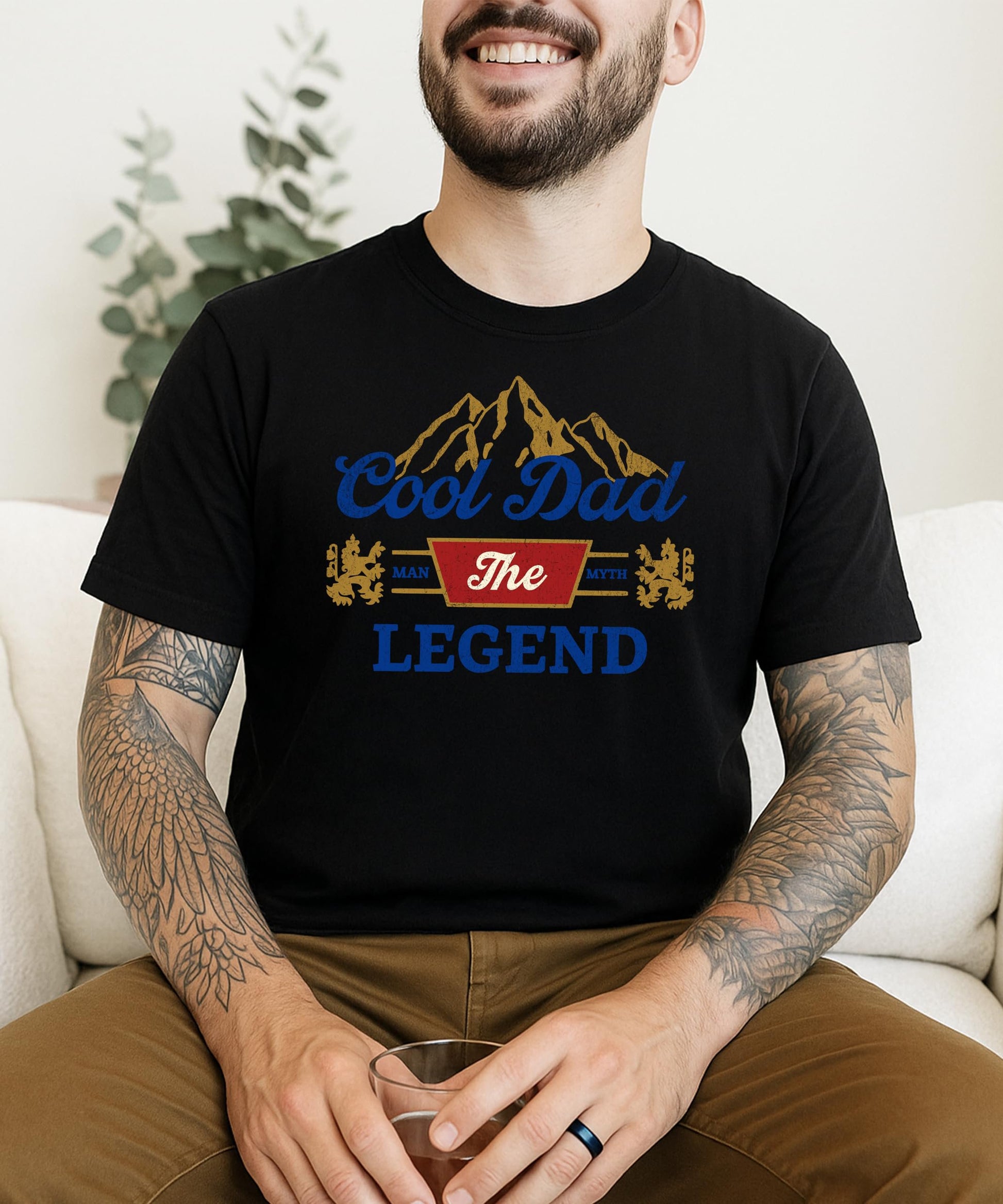 Flat lay of Cool Dad funny graphic t-shirt in black showing full design detail