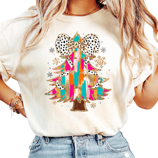 Women's seafoam shirt with faux glitter painted Christmas tree and dalmatian dot coquette bow graphic