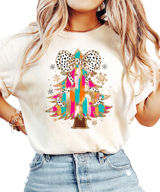 Women's seafoam shirt with faux glitter painted Christmas tree and dalmatian dot coquette bow graphic