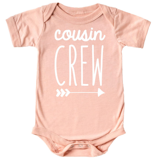 Size comparison of Cousin Crew arrow shirts in baby and toddler sizes