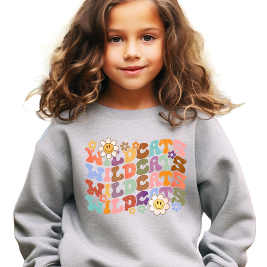 Vintage sports Wildcats sweatshirt displaying bold multicolor wavy text design